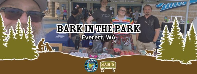 Sam&rsquo;s Cats & Dogs attending Bark in the Park in Everett, WA with staff at booth table displaying pet products during outdoor community dog event